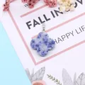 Polished four-leaf clover blue sodalite stone pendant with silver metal bail - Blue Spot Stone