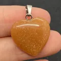 Hartvormige hanger van oranje aventurijn edelsteen met zilverkleurige metalen oog - Oranje Carneool