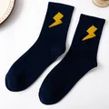 Dark blue crew socks in combed cotton featuring a vibrant yellow lightning bolt embroidery - Lightning Pattern / Navy Blue