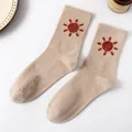 Beige combed cotton crew socks featuring a red sun embroidery and ribbed knit texture - Khaki