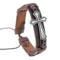 Close-up of brown leather bracelet with silver cross and woven hemp rope detailing - Brown Leather Silver Cross Style
