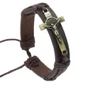 Detail of vintage brown leather bracelet featuring a brass crucifix with INRI engraving - Brown Jesus Crucifix Relief Cross Style