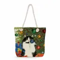 Detail of canvas tote bag with Christmas cat print and white woven cotton rope handles - Cow Cat Under Christmas Tree (ms2864)