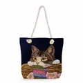 Detail of nautical rope handles and tabby cat print on a navy canvas beach tote bag - Woven Basket Tabby Cat (ms2880)