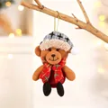 Detail of Christmas teddy bear ornament with grey plaid hat and red scarf on a tree - Linen Khaki Bear Doll