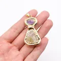 Detailed view of hand-held gold plated raw amethyst and citrine crystal stone pendant - No. 2 Single Color 50 Pieces/pack / 25-60mm,16-18g