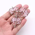 Three silver wire-wrapped heart pendants with pink natural stones on Tree of Life design - Rose Quartz
