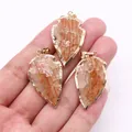 Pendentifs flèche en pierre naturelle avec bordure dorée et rayures orange vif - Agate à Rayures Rouges