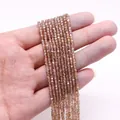 Vue détaillée de perles facettées champagne en forme de cube pour accessoires bijoux - 2.5x2.5mm