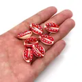 Macro detail of red and blue polka dot cowrie shell beads for DIY jewelry making - Style 5 (Red with Blue Dots)