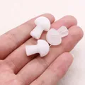 Three mini mushroom-shaped natural stones in white and pink displayed on a palm - White Crystal
