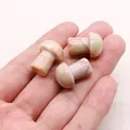 Polished dragon blood stone mushroom figurines with natural red veining and smooth texture - Red Network Stone
