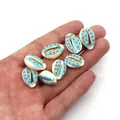 Eight light blue cowrie shells with orange polka dots for DIY jewelry making - Style 3 (Light Blue with Orange Dots)