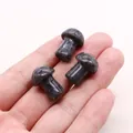 Three small mushroom-shaped Dragon Blood Stone carvings with polished finish in hand - Labradorite (Black Flash)