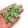 Macro detail of two-tone green and white conch shell beads for DIY jewelry making - Green & White