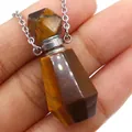 Detailed view of hand-held tiger eye stone perfume bottle pendant with silver chain necklace - 25x38mm / Tiger's Eye
