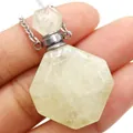 Close-up of yellow natural stone perfume bottle pendant with polished silver cap - 25x38mm / Citrine
