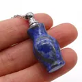 Macro shot of a blue lapis lazuli perfume bottle pendant on a fine silver chain - Vase Shape (Carved Bottle) / Lapis Lazuli