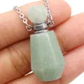 Macro shot of light green natural jade gemstone perfume bottle pendant on a silver chain - 25x38mm / Green Aventurine