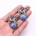 Vintage silver dragon pendant holding a blue round natural stone held in hand - 43x43mm / Blue Spot Stone