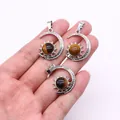 Three-piece silver sun and moon tiger eye pendants shown held against a white background - Pendant Only (22x29mm, Without Chain) / Tiger's Eye