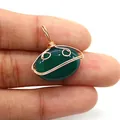 Detailed macro of a green agate oval pendant with handmade golden wire wrapping - Dark Green