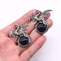 Retro viking dragon pendants with sparkling blue sandstone held in hand - 43x43mm / Blue Sandstone