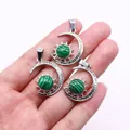 Three silver crescent moon and sun pendants with malachite stones held in hand - Pendant Only (22x29mm, Without Chain) / Malachite