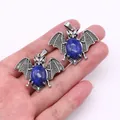 Vintage silver alloy bat pendant set with polished oval blue lapis lazuli stones - Lapis Lazuli