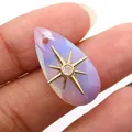 Macro shot of faceted teardrop purple crystal pendant with golden star and center zircon - Pendant Only (Without Chain) / Opal
