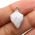 Gold plated white marble shield pendant with natural grey veins and faceted stone surface - Howlite