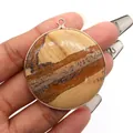 Polished round picture jasper stone pendant with elegant gold plated metal edge trim - Jasper