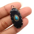 Macro shot of oval vintage pendant with turquoise stone inlay and gold serrated metal edges - Pendant Only (Without Chain) / Black Agate