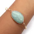 Gold plated open bangle with a large oval mint green natural stone and minimalist band - Amazonite