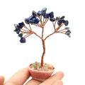 Lapis lazuli gemstone money tree with copper wire on a multicolored gravel base - Lapis Lazuli