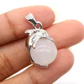 Silver dolphin-shaped pendant with a round pink gemstone bead inlay and metal clasp - Dolphin Shape / White Crystal