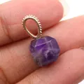Faceted purple amethyst square pendant with golden beaded bail shown held in hand - Purple Crystal