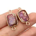 Close-up of rectangular purple imperial stone connector with gold plated metal frame - Fuschia