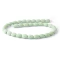 Macro-opname van ovale lichtgroene lavastenen kralen met poreuze textuur voor sieraden - 9x12mm, 24g / Lichtgroen