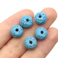 Sky blue volcanic lava stone beads for DIY jewelry making held in a hand - No. 4 (7x10mm) / Sky Blue