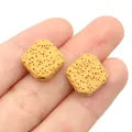 Square yellow volcanic stone beads on fingertip showing porous texture for DIY jewelry - 14mm (1 Strand) / Dark Yellow