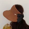 Women's foldable sun visor hat with large black bow and knit texture in caramel brown - M (56-58cm) / Coffee