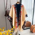 Beige knit poncho cape with geometric ethnic patterns and tassel fringe detail - Yellow