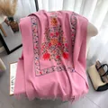 Ethnic floral embroidery scarf in dusty pink with tassel detail on a white chair - 185-65cm / Pink (CX-169)