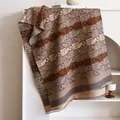 Brown knit scarf featuring retro elephant patterns and classic checkered print with fringe - 180x65cm / Brown