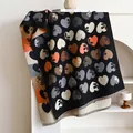 Reversible heart floral cashmere-feel scarf in black and orange with tassel edges - Black