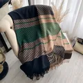 Cashmere-like scarf with houndstooth color block and long fringe on armchair - Dark Green