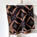 Close-up of geometric cashmere-feel scarf with black and brown patterns and delicate fringe - 185cm / Black Camel