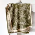 Detail of olive green floral cashmere scarf showing delicate fringes and soft texture - 185cm / Green