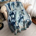 Elegant blue floral cashmere-like scarf with tassels draped on an armchair - Yh-118 Blue - Peony / 180x65